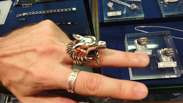 a larger silver ring of a wolf's head and neck ruff